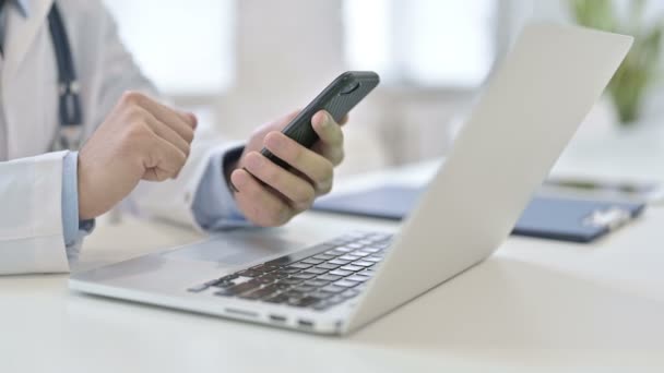 Close Up of Doctor Using Smartphone and Working on Laptop — Stock Video