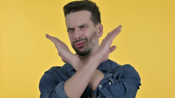 Portrait of Young Man saying No by Hand Gesture, Yellow Background — 비디오