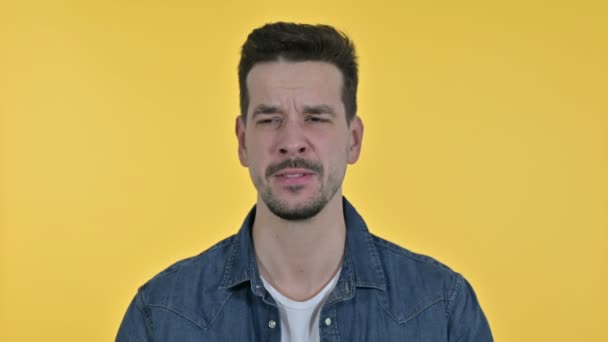 Portrait of Upset Young Man Crying at Camera, Yellow Background — 비디오