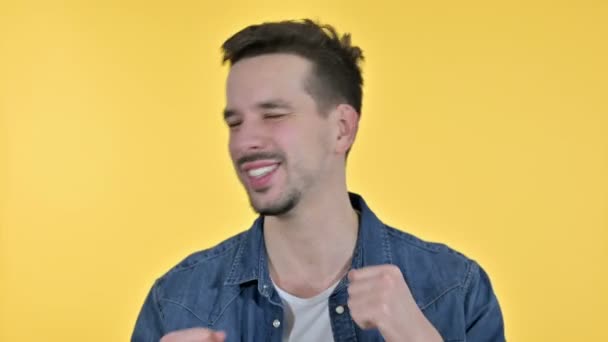 Portrait of Cheerful Young Man Dancing to Music, Yellow Background — Stok video