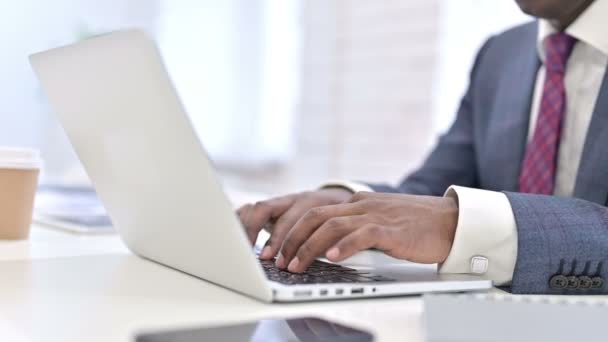 Close up of Hands of African Businessman working on Laptop in Office — Stockvideo