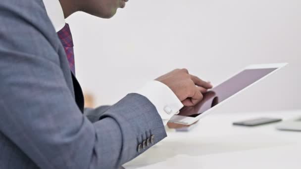 Close up of Professional African Businessman working on Tablet — Stockvideo