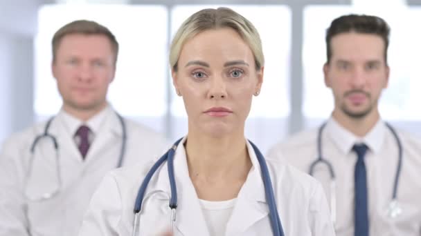 Portrait of Serious Female Doctor saying No by Finger Sign — 图库视频影像