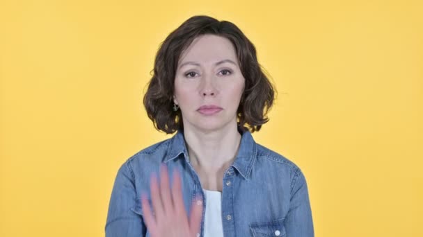 Stop Gesture by Old Woman on Yellow Background — Stock Video