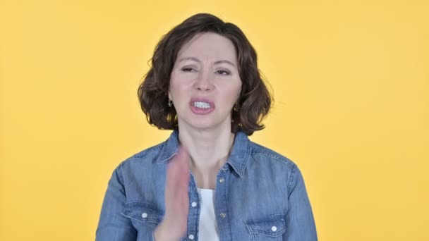 Old Woman with Toothache on Yellow Background — Stock video