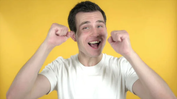 Happy Casual Man Dancing Isolated on Yellow Background – stockfoto