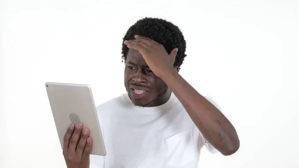 Casual African Man Reacting to Loss on Tablet Isolated on White Background — Stock Photo, Image