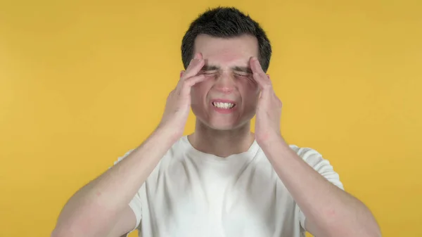 Casual Man with Headache Isolated on Yellow Background — Stock Photo, Image