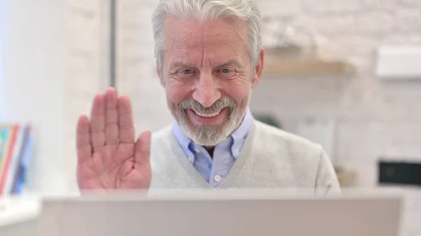 Close Up of Video Chat by Senior Old Man on Laptop