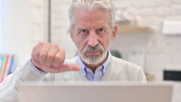 Close Up of Thumbs Down by Senior Old Man by Work — Stock fotografie