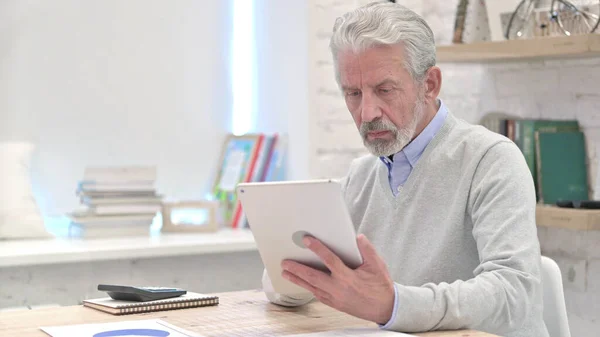 Senior Old Man Using Tablet in Office