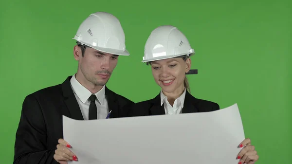 Male and Female Engineer Reading Blueprint , Chroma Key — Stock Photo, Image