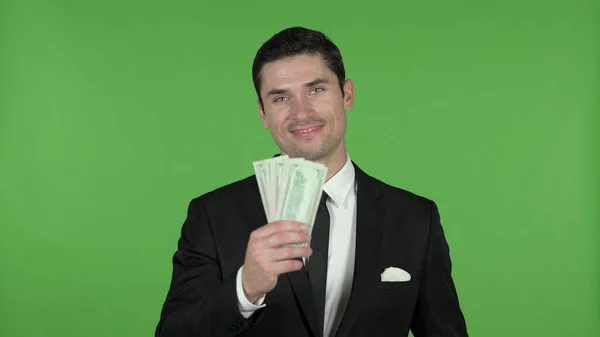 Young Businessman showing Money in Hand, Chroma Key — Stock Photo, Image