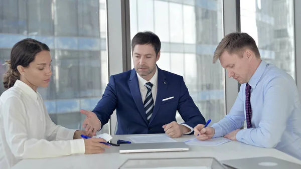 Middle Aged Businessman Talking with Team in Boardroom — Stock Photo, Image