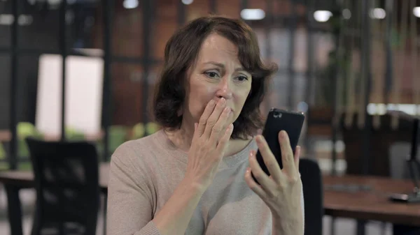 Old Woman Shocked by Results while Using Smartphone