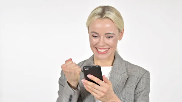 Excited Businesswoman Celebrating Success on Smartphone, White Background — Stock Photo, Image