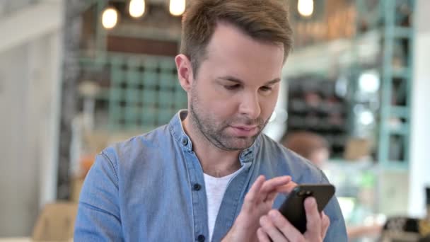 Portrait of Attractive Casual Man using Smartphone — Stock Video