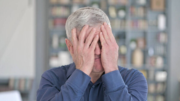 Portrait of Shocked Middle Aged Man Reacting to Failure by Hand Gesture