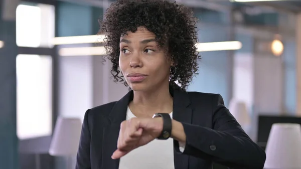 stock image Portrait of Anxious African Businesswoman Waiting for Someone while Checking her Smart Watch