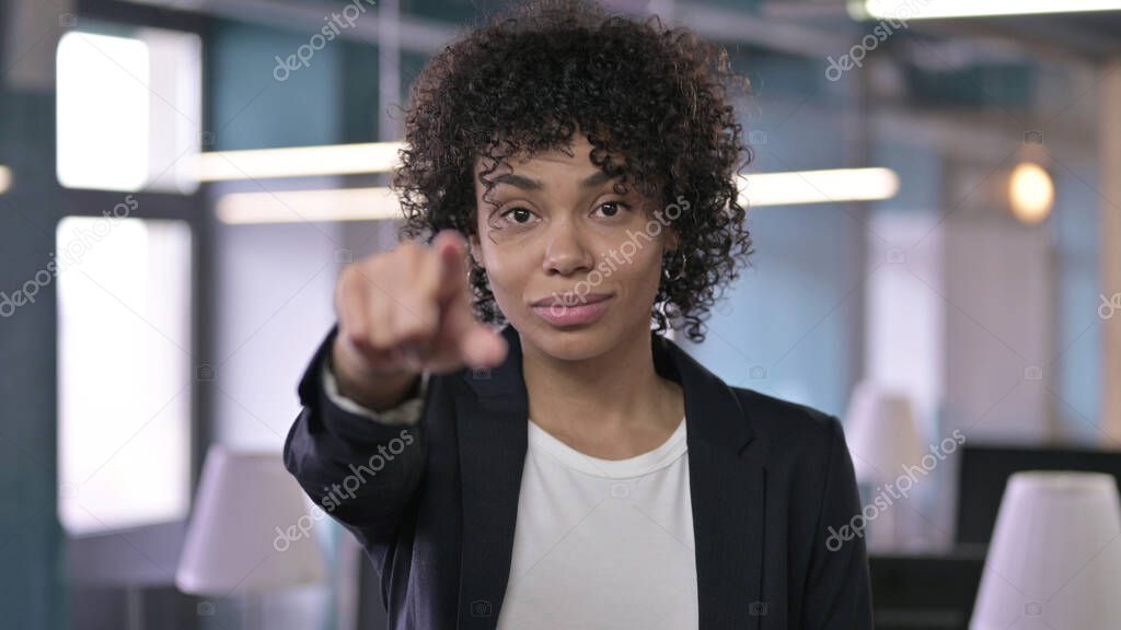 Portrait of Cheerful African Businesswoman Pointing Finger at the Camera