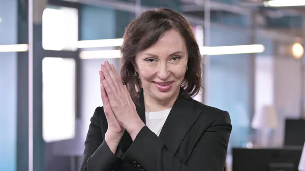 Portrait of Cheerful Old Businesswoman Clapping with Hands