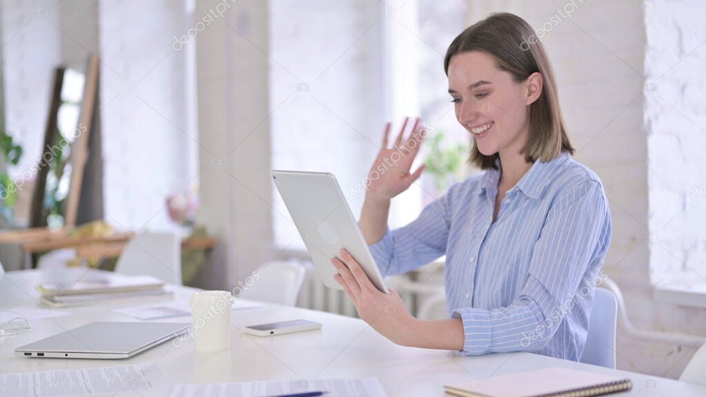 Cheerful Young Woman doing Video Chat on Tablet