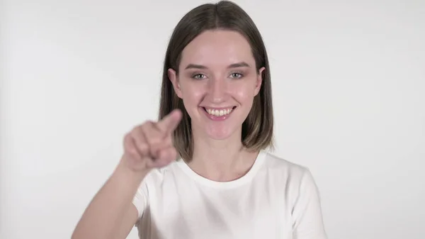 Ung kvinna pekar på kameran på vit bakgrund — Stockfoto