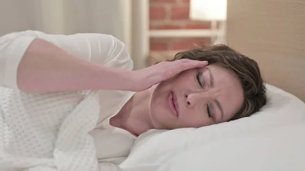 Sleeping Old Woman having Headache in Bed — Stock Photo, Image