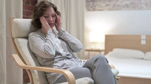 Tired Old Woman having Headache on Sofa — Stock Photo, Image