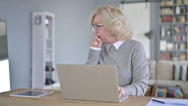 Sick Old Woman Coughing in Modern Office