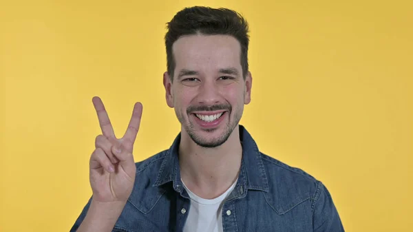 Successful Young Businessman showing Victory Sign, Yellow Background — 스톡 사진