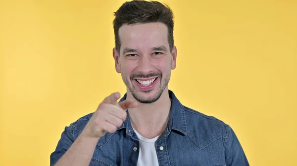 Attractive Young Man Pointing at Camera, Yellow Background — 스톡 사진