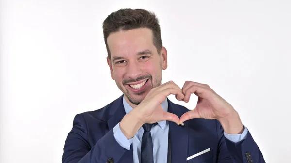 Fiatal üzletember csinál szív alakú kézzel, fehér háttér — Stock Fotó