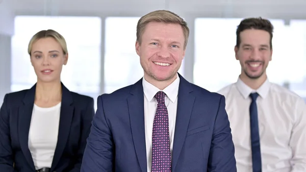 Portrait of Professional Team Smiling at the Camera in Modern Office — Stock Photo, Image