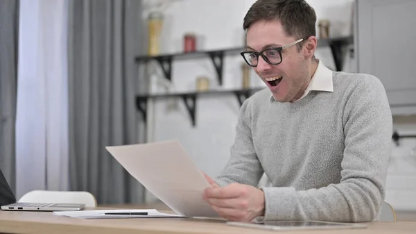 Excited Man Celebrating after Reading Documents, Paperwork — Stock Photo, Image