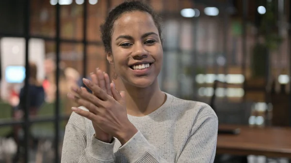 Excited African Woman Clapping for Team, Applauding