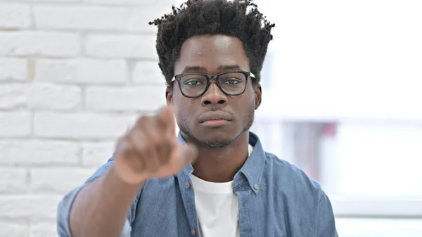 Serious Young African Man Pointing Finger — ストック写真