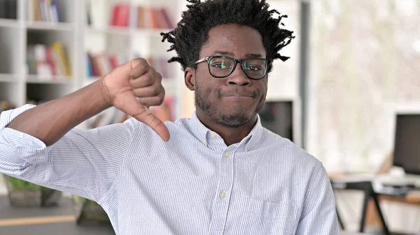 Thumbs Down by Disappointed Young African Man