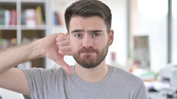Portrait of Thumbs Down by Disappointed Young Man — Stock Photo, Image