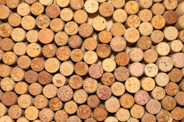 Primer plano de la pared de corchos de vino usados fondo — Foto de Stock