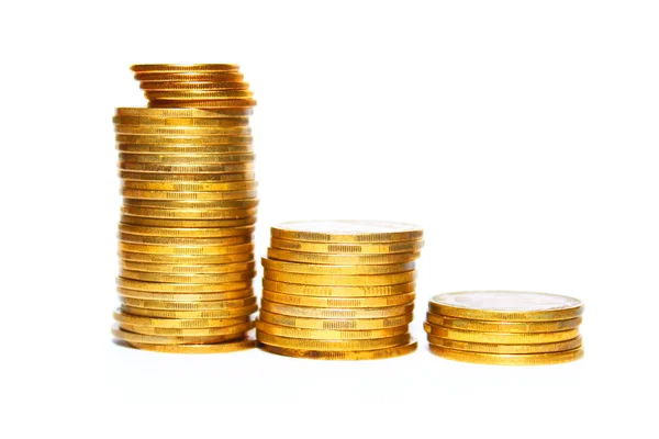 Stos złote monety na białym tle na białe tło zbliżenie — Zdjęcie stockowe