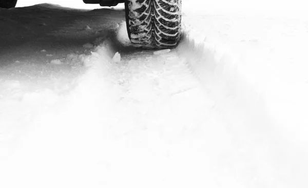 Winter tire on snow — Stock Photo, Image