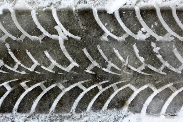 Car track close-up in the winter on wet snow — Stock Photo, Image