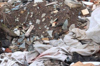 Construction waste with elements of and destroyed old structures at municipal landfill
