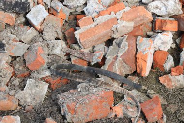 Construction waste with elements of and destroyed old structures at municipal landfill