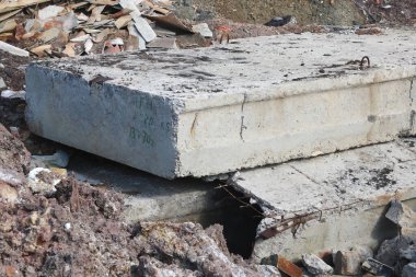 Construction waste with elements of and destroyed old structures at municipal landfill