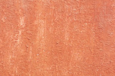 Yüzeyi pürüzlü eski kırmızı boyalı güzel bir klasik arka plan, eski pürüzlü yüzeyde kırmızı boya izleri ve pürüzlü dokuları var.