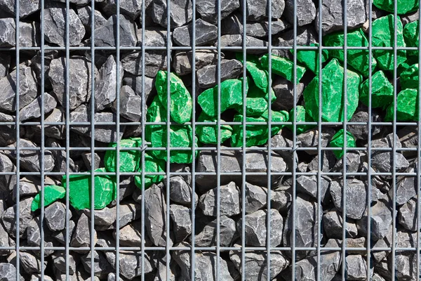 green stones in a grid box