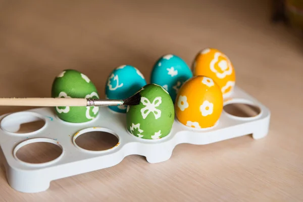 Colored eggs on a stand — Stock Photo, Image