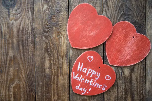 Red hearts on wooden background — Stock Photo, Image